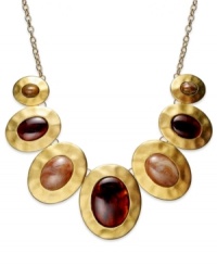 With antiqued appeal, this statement necklace from Style&co. flaunts hammered pendants with smoky resin accents. Crafted in matte gold tone mixed metal. Approximate length: 18 inches. Approximate drop: 5-1/2 inches.