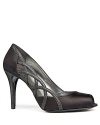 With sparkling leather accents, Stuart Weitzman's Arcade evening pumps show off side cutouts and a shimmering heel.