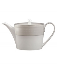 Set a dazzling tea or coffee service with this fine china teapot. From innovative designer Monique Lhullier, it features a pearlescent border with glossy raised dots and a fine stitch-like pattern.