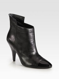 An elevated architectural design of sumptuous leather, topped with a patent cap toe and trim. Leather-covered heel with patent leather trim, 4¼ (110mm)Leather and patent leather upperLeather lining and solePadded insoleImported