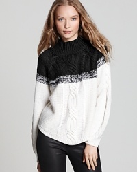 This classic black and white tweedy-textured 525 America sweater is the fall essential for casual denim days when equal parts comfort and style top your must-have list.