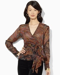 A flowing silk blouse is crafted in a flattering wrap silhouette for breezy, feminine appeal.