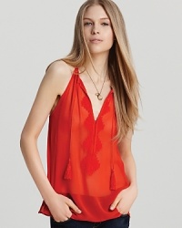 This fiery red Joie tank exudes bohemian Parisian sensibility with delicate embroidery at the bodice and tasseled neck ties--the perfect marriage of summer's chicest accents.