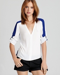 Introduce the color-block trend into your wardrobe with this BCBGMAXAZRIA top, accented with a pop of contrast color.