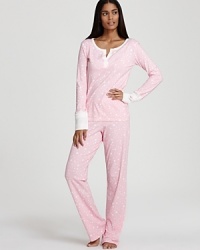 Shine the brightest in this all-over star-print pajama set from 40 Winks.