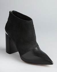 These aggressively fashionable See by Chloé booties get right to the point, finished with striking metallic heel accents.