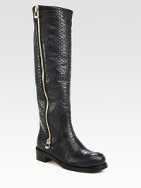 A long exposed zipper lines this tall silhouette, impeccably crafted of rich snake-embossed leather. Stacked heel, 1½ (40mm)Shaft, 16½Leg circumference, 14½Snake-embossed leather upperSide zipLeather liningRubber solePadded insoleMade in Italy