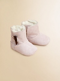 Precious baby booties crafted in ultra-plush suede with shearling lining and toggle button closure.Toggle closureLeather upperShearling leather liningLeather solePadded insoleImported