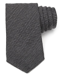 A premier silk tie from Armani Collezioni is a true classic in herringbone, a timeless pattern you can wear again and again.