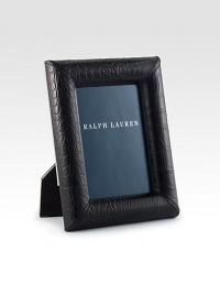 Crafted from elegant leather, this single-photo frame exudes modern polish with an embossed croc pattern.Embossed leatherNickel-plated brass detailing on back of frame7.75 X 9.75 X 1.6Fits 5 X 7 photosImported