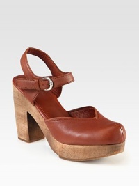 An instant leather staple with an elevated wooden platform and adjustable ankle strap. Wooden heel, 4 (100mm)Wooden platform, 1 (25mm)Compares to a 3 heel (75mm)Leather upperAdjustable ankle strapLeather liningRubber solePadded insoleImportedOUR FIT MODEL RECOMMENDS ordering true size. 