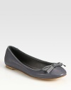 Sophisticated leather flat with grosgrain trim and a dainty bow. Leather upperLeather lining and solePadded insoleImportedOUR FIT MODEL RECOMMENDS ordering true size. 