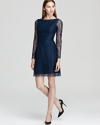 All out glamorous, Shoshanna's lace dress goes luxe with sheer lace sleeves and scalloped details.