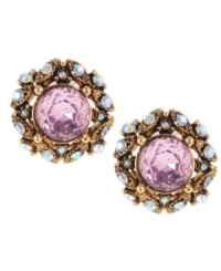 Lovely and ladylike. Pretty faceted pink crystals stand out on these sweet stud earrings from Betsey Johnson. Adorned with glittering clear crystal accents, they're crafted in antique gold tone mixed metal. Approximate diameter: 5/8 inch.