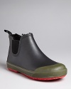 A stylish all-weather boot with a textured contrast toe, pull tab at back and side elastic closure for a easy on/off.