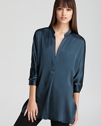 Fashioned in shimmering silk, this Vince tunic layers over your favorite skinnies for effortless chic.