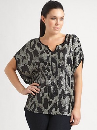 A stunning pattern of sequins creates a sophisticated shimmer on this shapely dolman sleeve top of silky modal knit.Scoop neckline with center notchShort dolman sleevesPieced waistContrast pipingAbout 28 from shoulder to hemModalSpot cleanImported