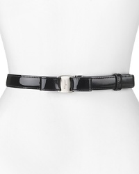 With it's slick patent leather and feminine bow detailing, Salvatore Ferragamo's leather belt lends every look polished sophistication.