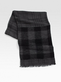 A modern cool check design is printed on this rich wool blend scarf with allover fringe trim.Fringed ends28W x 72LViscose/wool/polyamide/modal/cottonDry cleanMade in Italy