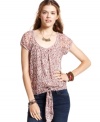 Delicate floral print and relaxed, tie-front design lend femme and carefree spirit to this top from American Rag!