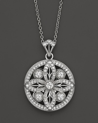 Faceted diamonds set in a gorgeous baroque 14K. white gold pendant.