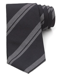 A handsome stripe tie is rendered with a narrower width for a balanced approach to modern trends and classic refinement.