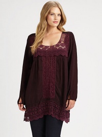 Quite possibly the prettiest tunic around, this pullover lace-detailed style offers a whimsical look and a flattering fit. Pair it with your favorite skinnies.ScoopneckLong sleevesLace detailsScalloped hemAbout 35 from shoulder to hemRayonMachine washImported