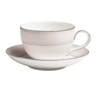 World-renowned fashion designer Monique Lhuillier collaborated with Waterford to create this fine china saucer in beautiful blush tones adapted from her brilliant couture bridal gowns and red carpet creations.