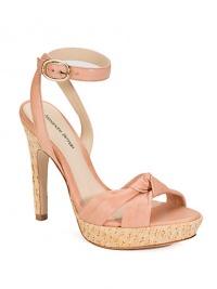 Rustic straw heel and platform underneath a supple leather look with a knot detail and crisscross ankle strap.Straw-covered heel 4½ (115mm) Straw-covered platform, ½ (15mm) Compares to a 4 heel (100mm) Open toe Top knot detail Crisscross ankle strap Leather lining and sole Padded insole Imported