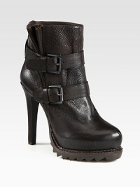 Daring silhouette of pebbled leather with a fierce heel, adjustable buckle straps and sawtooth rubber sole. Self-covered heel, 5 (125mm)Rubber platform, ¾ (20mm)Compares to a 4¼ heel (110mm)Leather upperAdjustable buckle strapsLeather liningRubber sawtooth solePadded insoleImported