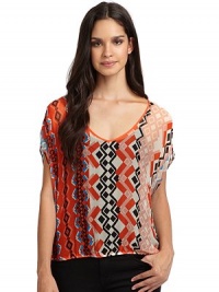 THE LOOKAllover tribal-inspired printElastic waistBack cutout detailTHE FITAbout 21 from shoulder to hemTHE MATERIALRayonCARE & ORIGINDry cleanMade in USAModel shown is 5'11 (180cm) wearing US size Small. 