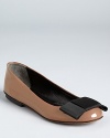 A modern, flat bow adorns the toe of Moschino Cheap and Chic's Suzanne flats, classic in glossy, nude leather.