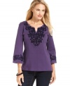 Beautiful braided trim and sparkling rhinestones give JM Collection's petite tunic an exotic, appealing look.