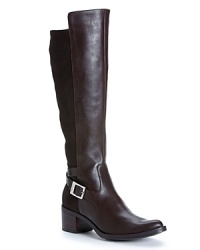 These Calvin Klein boots add a bit of height to your style while maintaining the look of tall, flat boots. Visually distinctive shafts feature microfiber stretch panels to ensure the perfect fit.