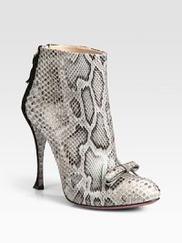 Exude confidence in this scintillating design of genuine python and suede, topped with a petite bow. Suede-covered heel, 4¼ (110mm)Python and suede upperBack zipLeather lining and solePadded insoleMade in ItalyOUR FIT MODEL RECOMMENDS ordering one half size up as this style runs small. 