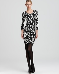 Classic in black & white, this DKNY dress is crafted in luxe silk and detailed with side ruching for a hint of texture.