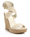 Stuart Weitzman Alex crochet espadrilles. Woven wrap ankle strap with adjustable buckle closure. 4.5 braided straw covered wedge with 1 platform.