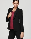 A careerist staple gets contemporary edge as slim tailoring and standout seaming define a Bloomingdale's exclusive Gerard Darel blazer.