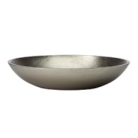 Organically molded under fire, this handmade bowl exudes metal artistry with a New York edge.