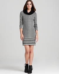 With a stylish mash-up of solid neutrals, and timeless houndstooth and herringbone prints for classic chic, this Cut25 Sweater dress is the definitive silhouette for fall.