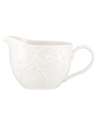 With an elegant white-on-white pattern featuring an embossed vine motif and radiant glaze, the Opal Innocence Carved gravy boat gets your table set for refined dining every day.