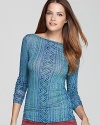 A geometric pattern prettifies this BCBGMAXAZRIA top, formulated in a lightweight, easy-to-wear stretch knit.