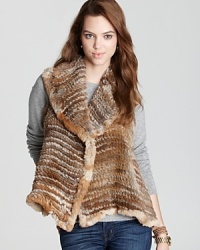 Plush draping and a longer length in back lend sumptuous appeal to Adrienne Landau's fur vest.