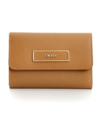 Stay organized anywhere you go with this travel-ready wallet from DKNY that's the right reserve for all your riches. Luxe leather is accented with custom hardware, while the interior is outfitted with plenty of pockets and compartments.