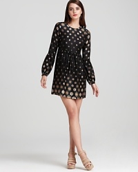 Hippie-chic arrives with this Twelfth Street by Cynthia Vincent mini dress with bell sleeves and a babydoll-inspired silhouette. Add wedge sandals to the printed look and head out with the band.