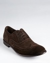 Traditional brogue detail adds classic appeal to these soft suede wingtips, adding character to your repertoire.