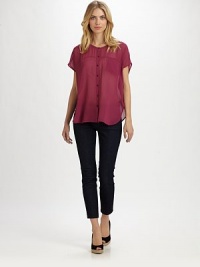 A silk button-down blouse offering a relaxed fit and everyday-chic look.Round neckShort sleevesButton frontAbout 26 from shoulder to hemSilkDry cleanImported