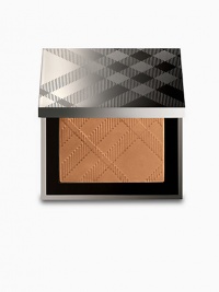 A multi-sensory texture that reproduces the skin's natural colour. Warm Glow Natural Bronzer warms the complexion to achieve a sun-kissed look as emollient agents smooth the skin offering a natural and healthy glow. Contains UV filters to protect from damaging environmental exposure. Apply with the Burberry Beauty Brush in a circular motion from the cheek into the hairline. Lightly dust across rest of face to give a sun-kissed look. 