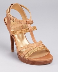 A mixed material masterpiece--Stuart Weitzman's Themost sandals combine lanyard, cork and leather, resulting in a statement-making shoe sure to please the most discriminate footwear lover.