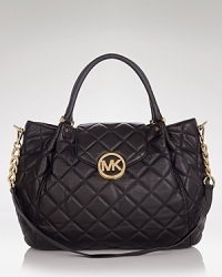 MICHAEL Michael Kors is known for jet-setting glamour, and this satchel puts its signature spin on a classic, wear-for-ever handbag, styled in quilted leather with gleaming hardware.